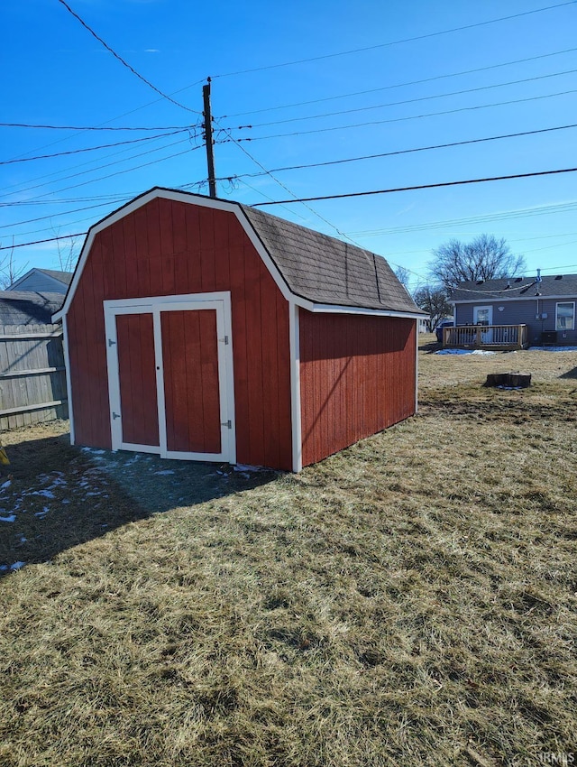 view of outbuilding featuring a lawn