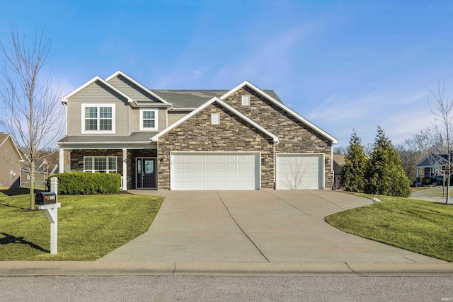 craftsman inspired home featuring a garage and a front lawn