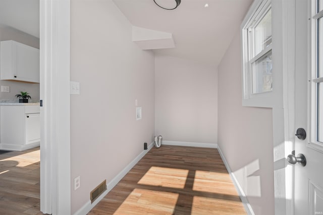 laundry area featuring hardwood / wood-style flooring