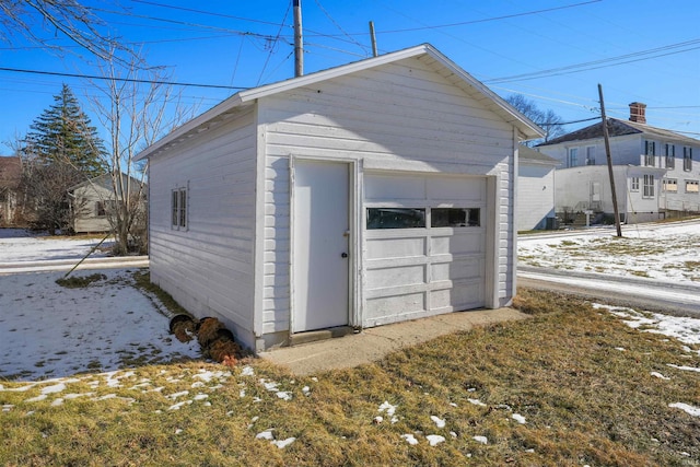 view of snow covered garage