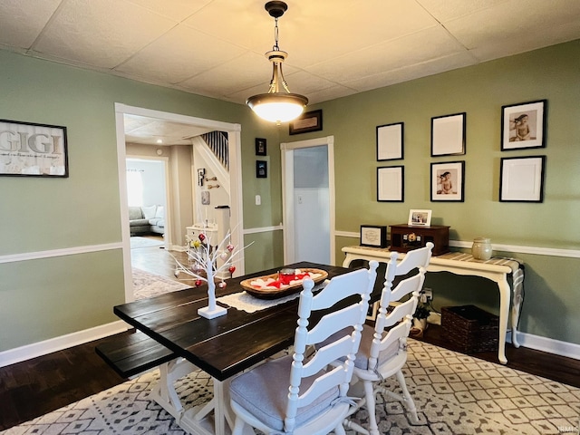 dining space featuring wood-type flooring