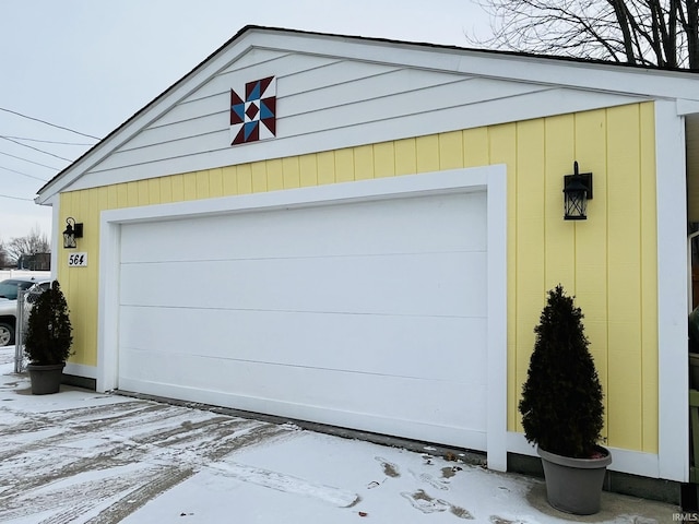 view of snow covered garage