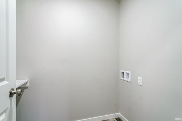 laundry room with washer hookup and hardwood / wood-style floors