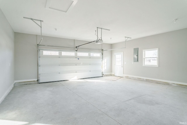 garage featuring a garage door opener and electric panel