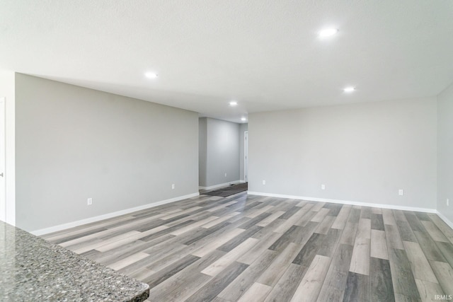 spare room with light hardwood / wood-style flooring