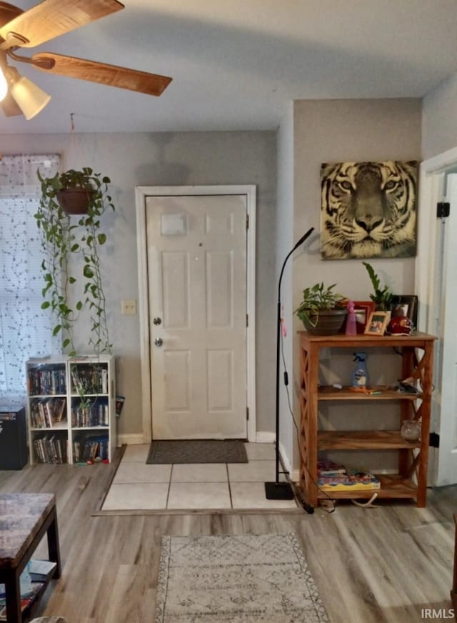 foyer featuring ceiling fan and light hardwood / wood-style flooring