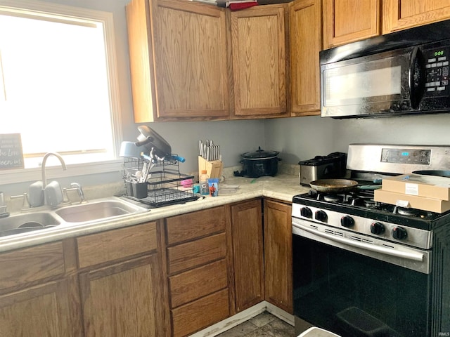 kitchen with sink and stainless steel gas stove