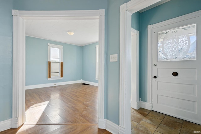 entryway with hardwood / wood-style floors