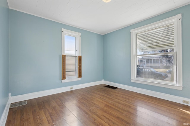 spare room with wood-type flooring