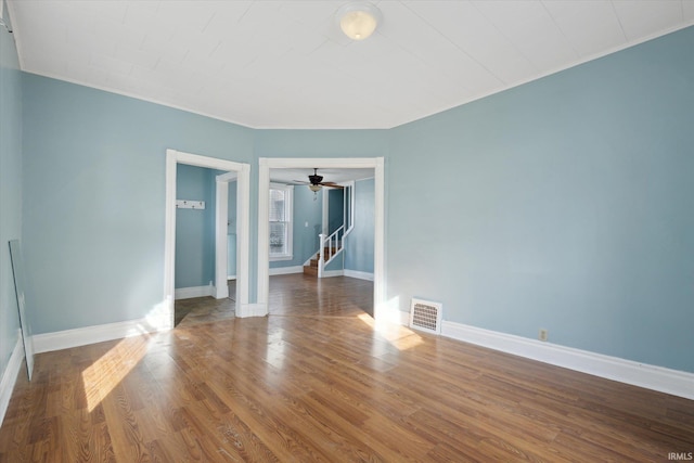 unfurnished room with hardwood / wood-style floors