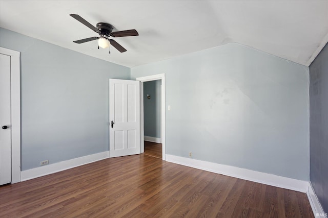 unfurnished room with ceiling fan, dark hardwood / wood-style floors, and vaulted ceiling