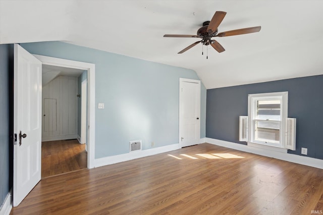 interior space featuring hardwood / wood-style flooring, vaulted ceiling, and ceiling fan