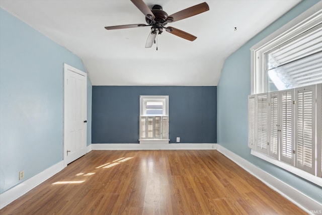 interior space with vaulted ceiling, ceiling fan, and light hardwood / wood-style floors