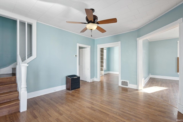 spare room with ornamental molding, hardwood / wood-style floors, and ceiling fan