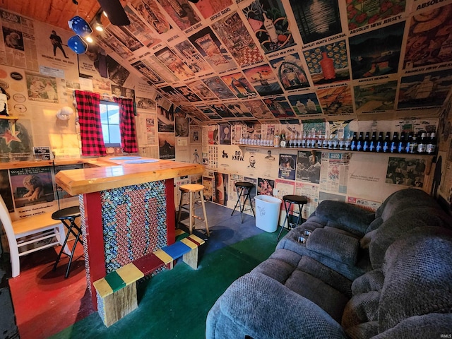 interior space featuring vaulted ceiling and indoor bar