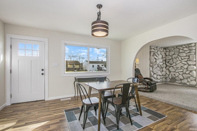 dining room featuring dark hardwood / wood-style flooring