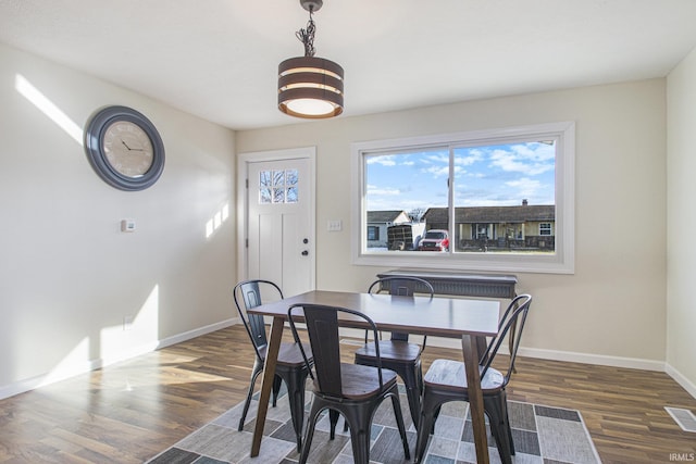 dining area featuring dark hardwood / wood-style floors