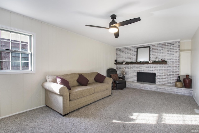 living room featuring ceiling fan, light colored carpet, and a fireplace