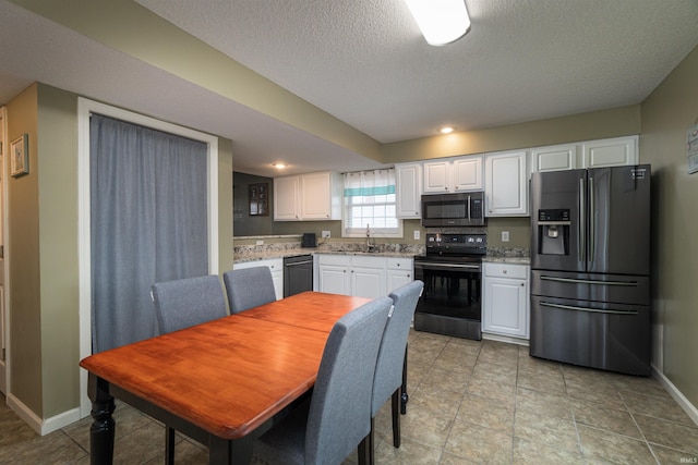 kitchen with sink, dishwasher, electric range, fridge with ice dispenser, and white cabinets