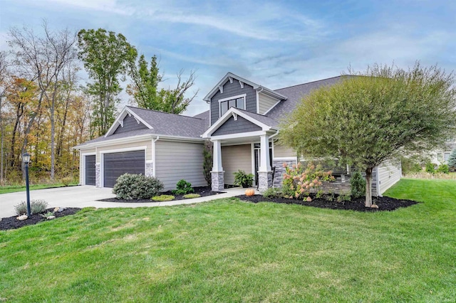 view of front of house featuring a garage and a front yard