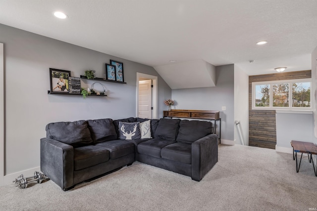 living room with lofted ceiling and carpet