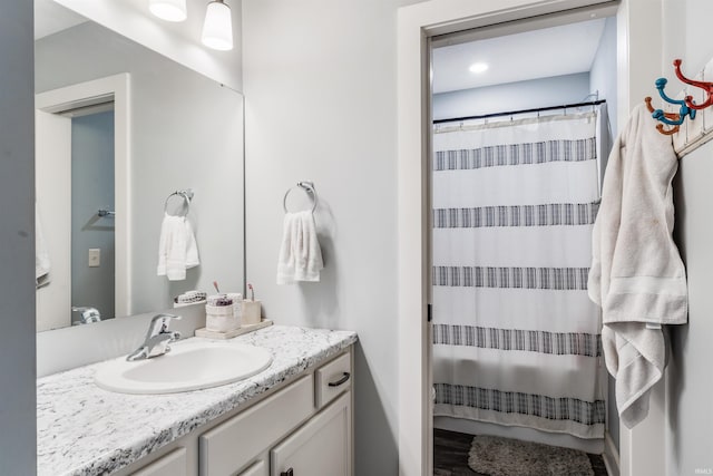 bathroom with vanity and curtained shower