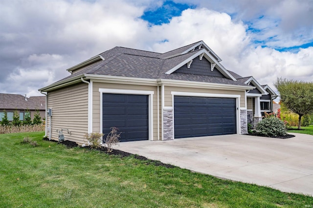 view of property exterior with a yard and a garage