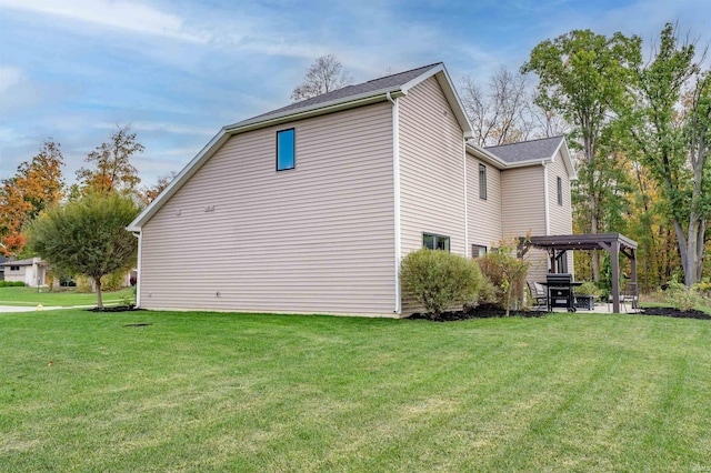 view of home's exterior featuring a gazebo, a patio, and a lawn