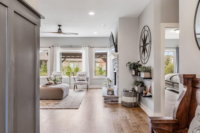 interior space with ceiling fan and wood-type flooring