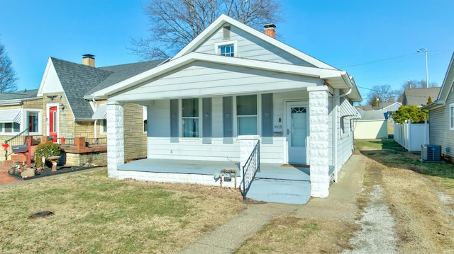 view of front of property featuring a porch, central AC, and a front yard