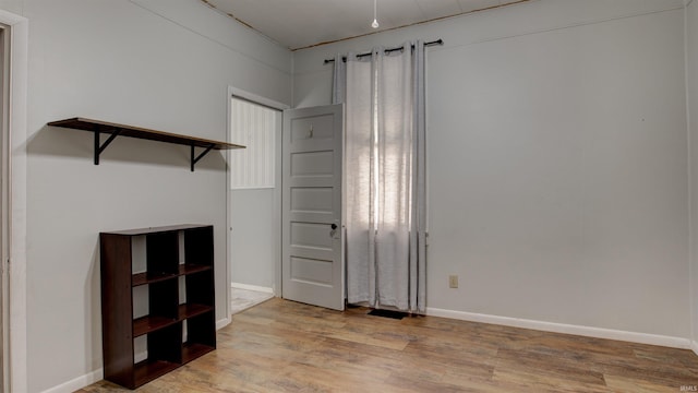 empty room featuring light hardwood / wood-style floors