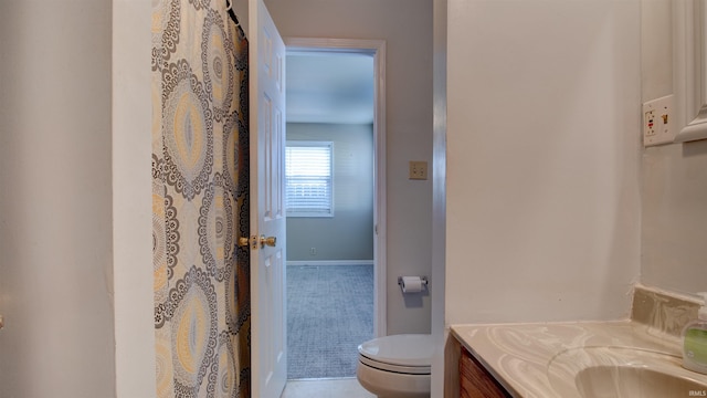 bathroom featuring vanity and toilet