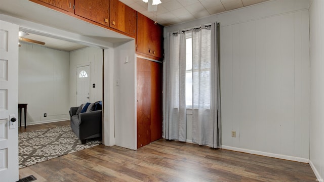 interior space with hardwood / wood-style flooring and ceiling fan