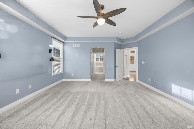 interior space featuring light colored carpet and ceiling fan