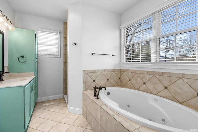 bathroom with vanity, tile patterned floors, and plus walk in shower