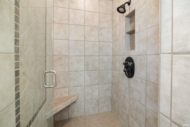 bathroom featuring tiled shower