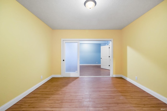 unfurnished room featuring light wood-type flooring