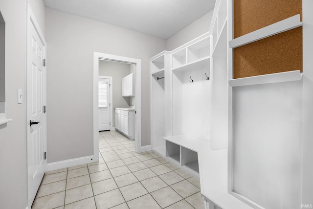 mudroom with light tile patterned floors