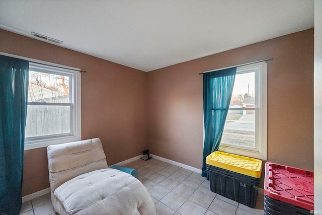 sitting room featuring light tile patterned flooring