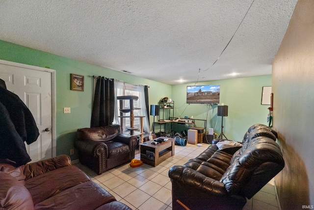 tiled living room featuring a textured ceiling