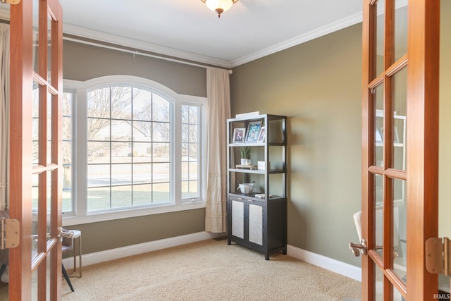 interior space with french doors, ornamental molding, and carpet flooring