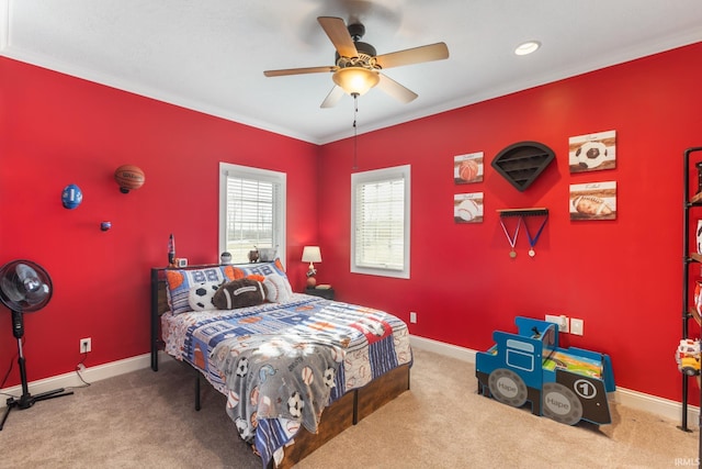 bedroom featuring crown molding, ceiling fan, and carpet