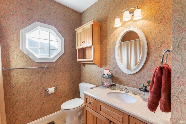 bathroom with vanity and toilet