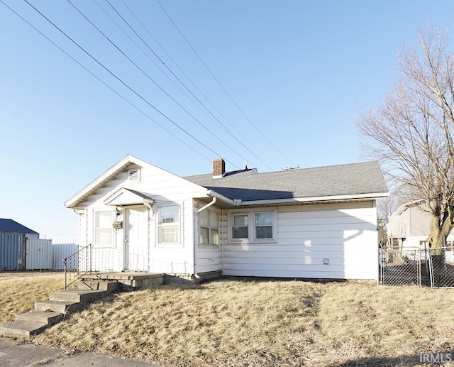 view of front of home with a front yard