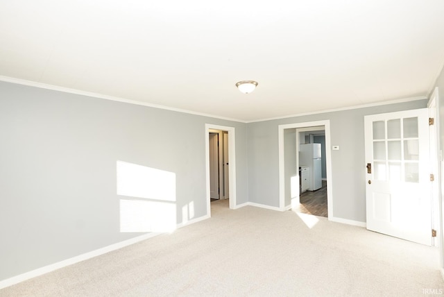 carpeted empty room with crown molding