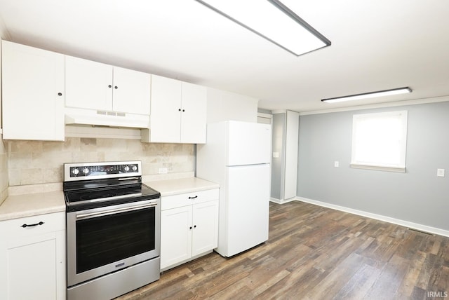 kitchen with tasteful backsplash, white cabinets, dark hardwood / wood-style flooring, stainless steel range with electric stovetop, and white fridge