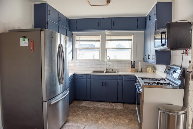 kitchen with blue cabinets, sink, decorative backsplash, and appliances with stainless steel finishes