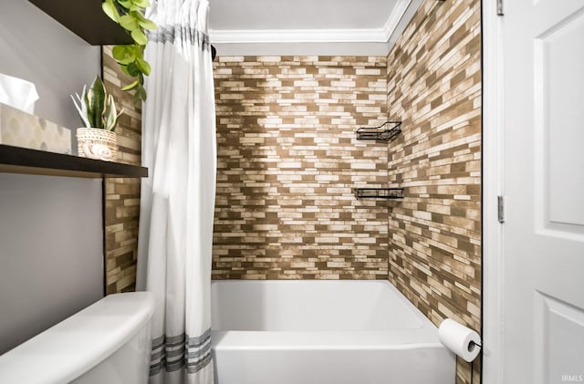 bathroom featuring crown molding, shower / bath combination with curtain, and toilet