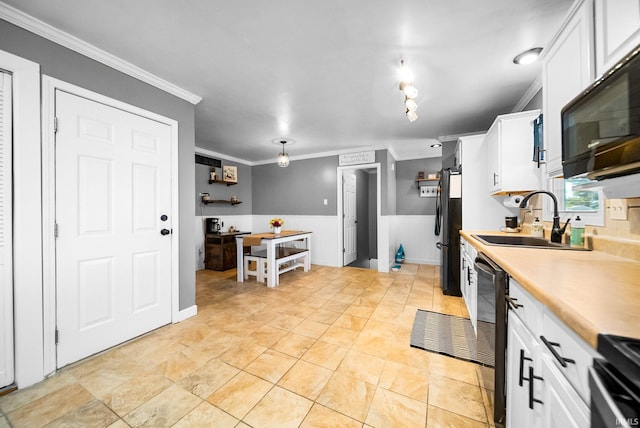 kitchen with sink, white cabinetry, ornamental molding, black appliances, and light tile patterned flooring