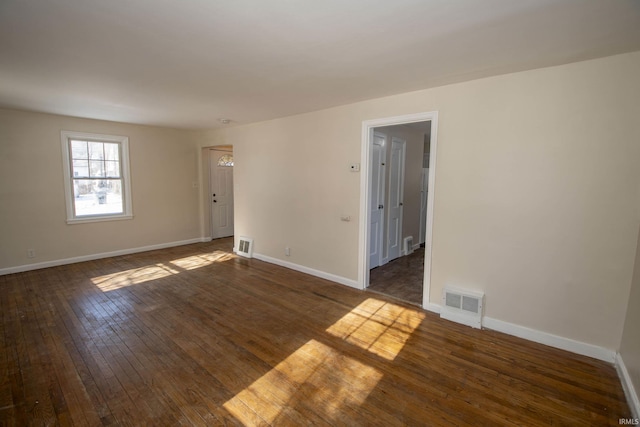 empty room featuring dark hardwood / wood-style floors